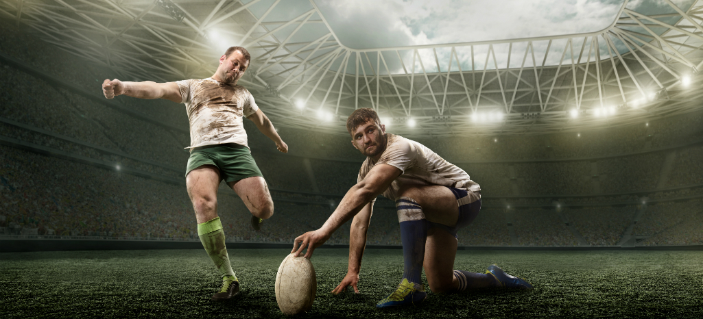 Joueur de rugby frappant une pénalité